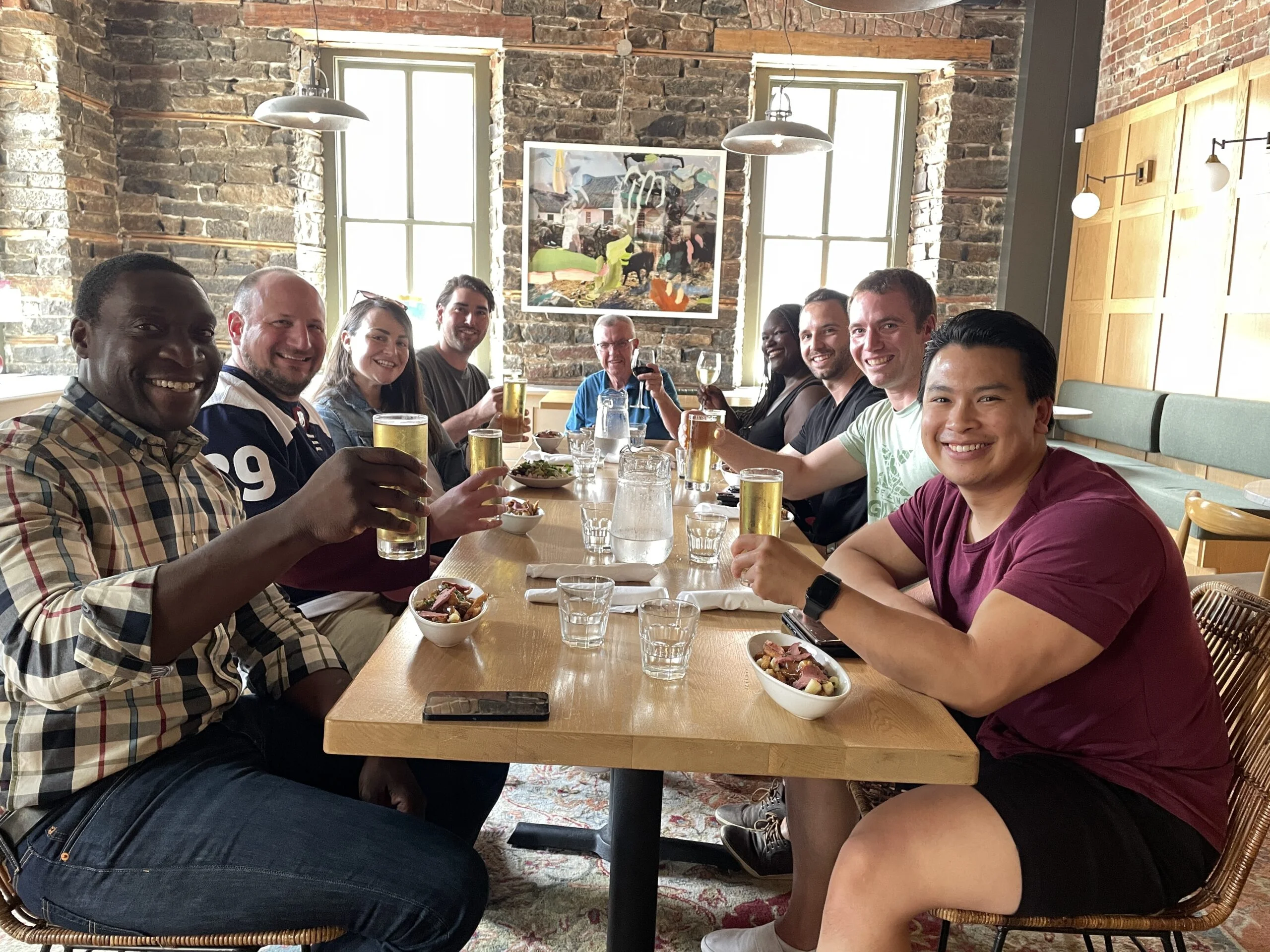 Group of colleagues toasting at Clarendon Tavern