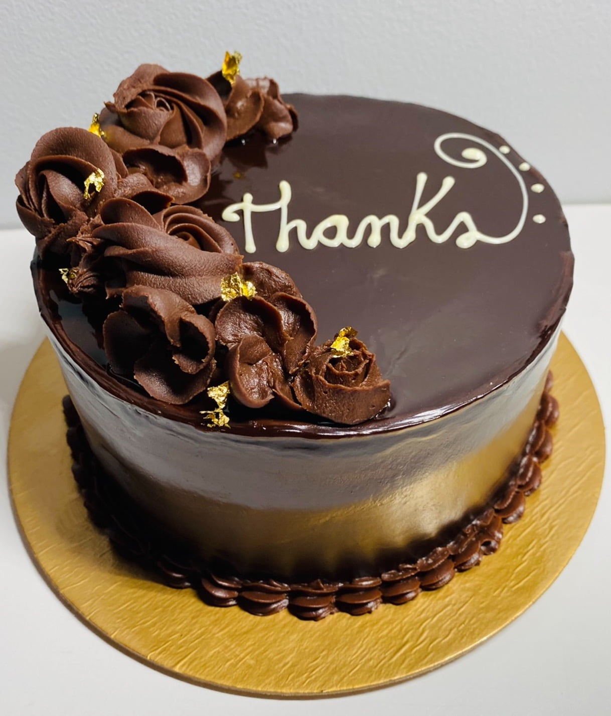 chocolate cake with the word THANKS on it